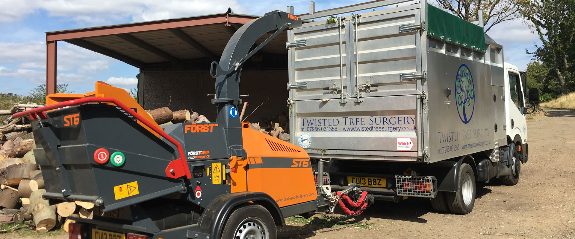 Twisted Tree Surgery truck and Förster chipper at the yard